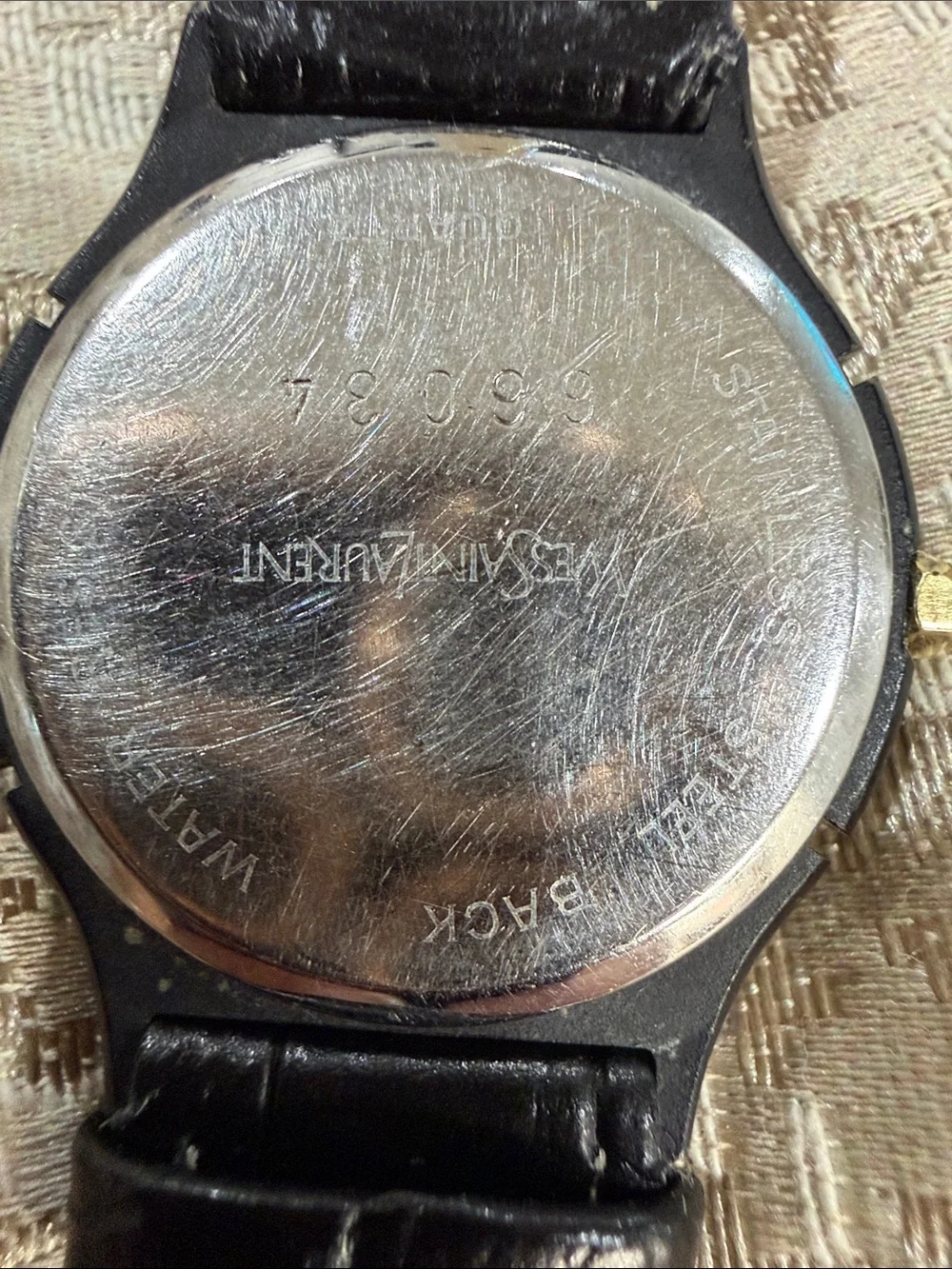 Yves Saint Laurent Black Leather Watch with Gold Accents and Silver Dial